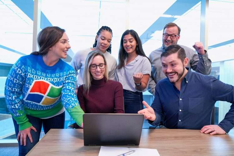 business people looking at a laptop