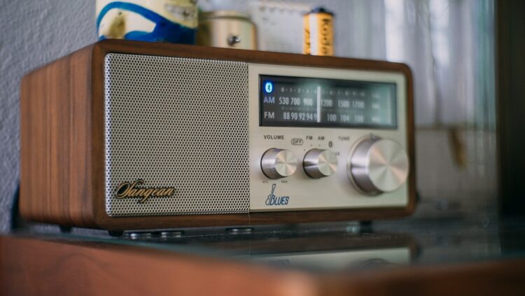 gray and black radio on black table